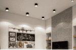 Surface mounted LED down light illuminating contemporary ceiling design.