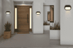 LED aluminum bulk head light illuminating a contemporary entrance door.