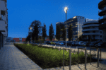 LED garden pole light with three heads for outdoor illumination.