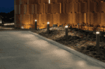 LED bollard lighting along pathway at night for outdoor illumination.