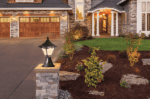 Outdoor classic base lantern illuminating garden pathway and driveway.